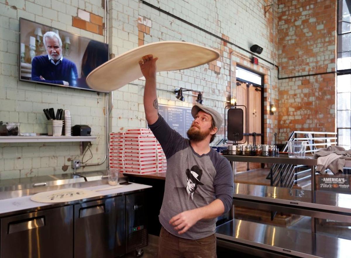 Jimmy Gadd tossed the dough for a 22-inch pizza in December 2016 in Goodfellas Distillery off Manchester Street in Lexington.