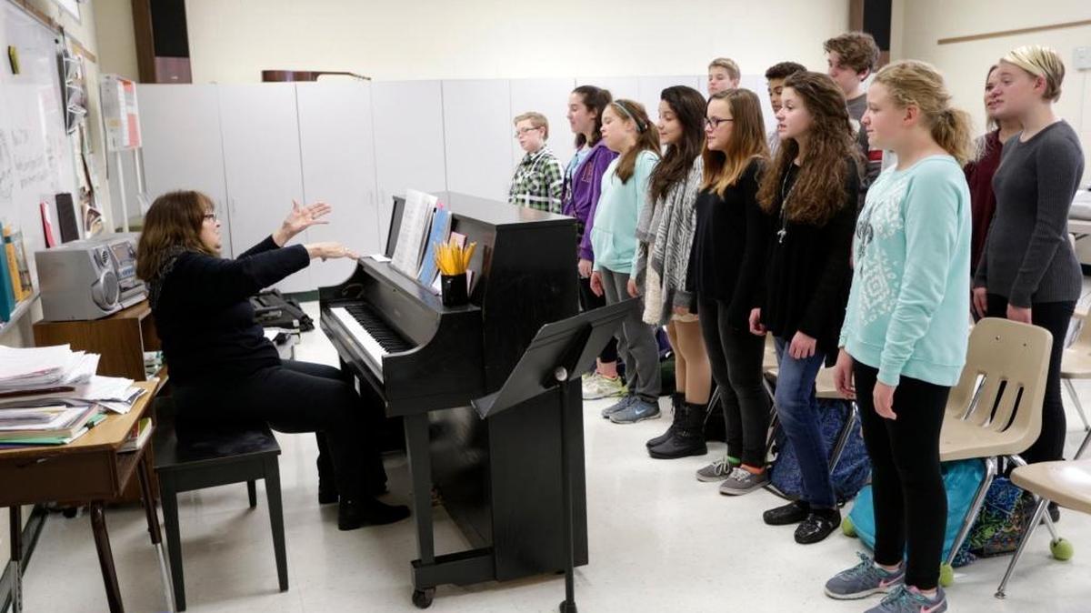 A school choir practices.
