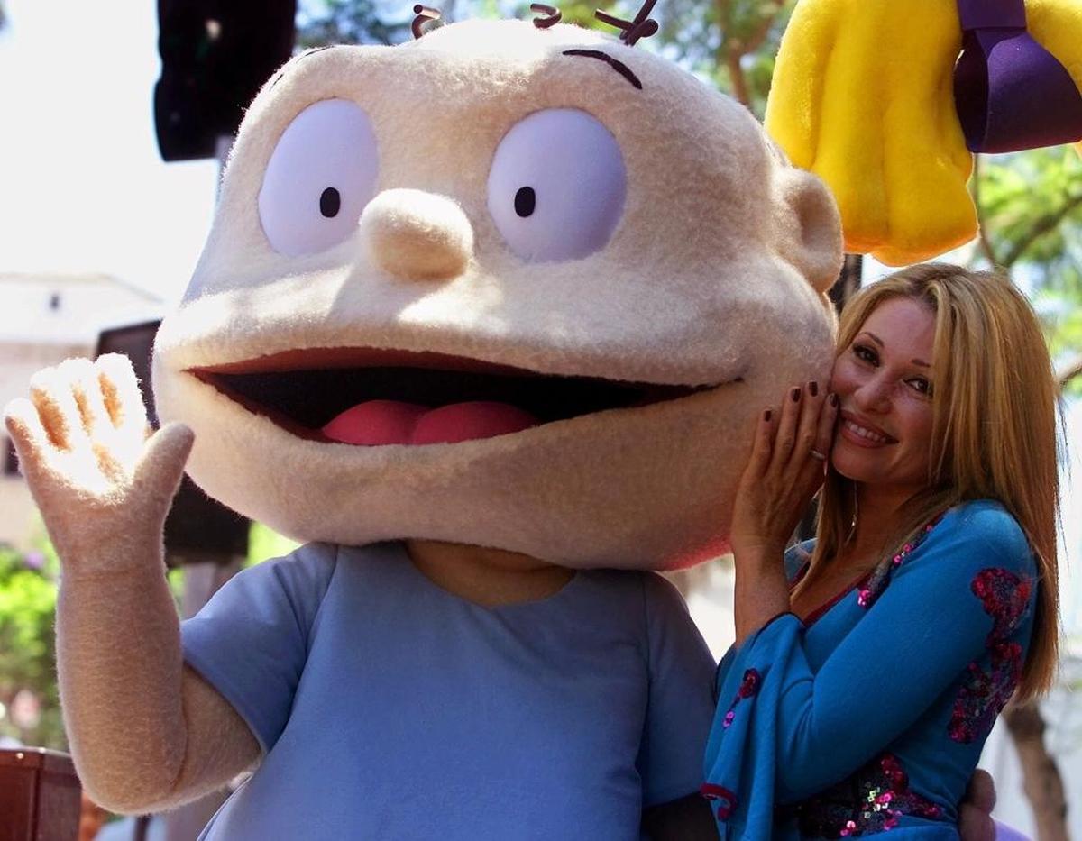 E.G. Daily poses with the “Rugrats” Tommy Pickles, one of many characters she has voiced, including Buttercup on “The Powerpuff Girls.”
