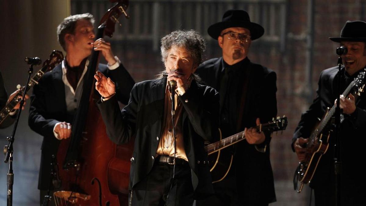 Bob Dylan, shown performing at the Grammy Awards in February, won the Nobel Prize in literature, but he has not yet publicly acknowledged it.