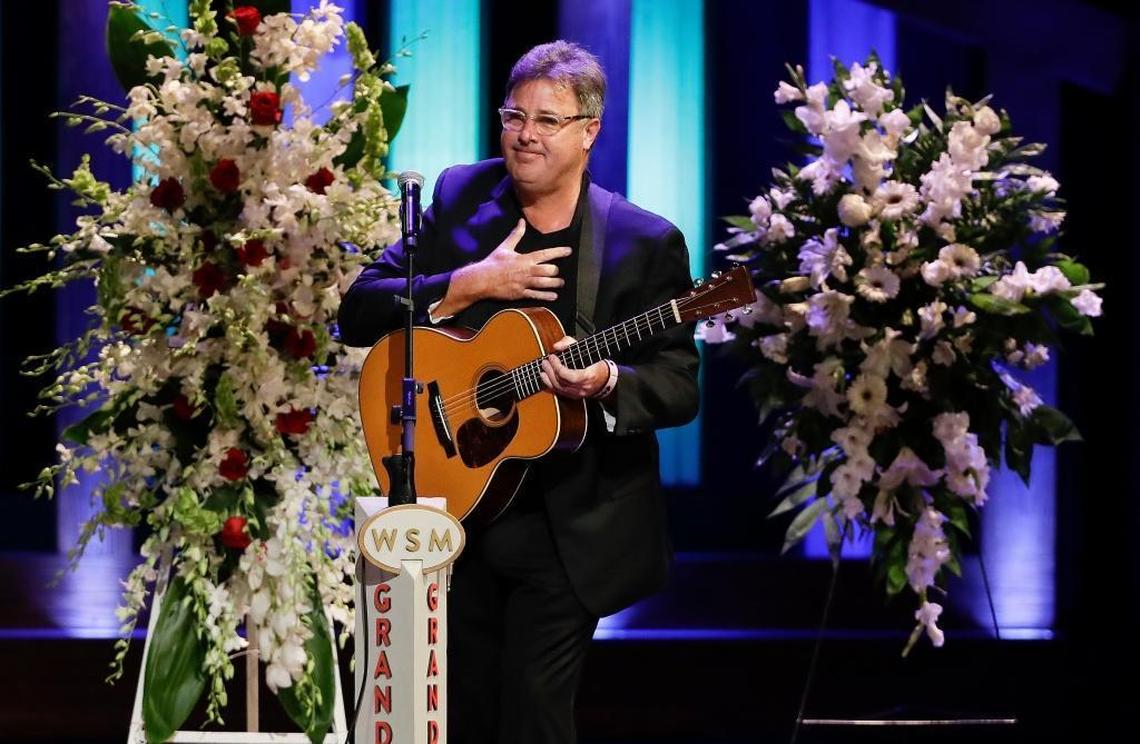 Vince Gill leaves the stage after performing during a memorial service for country music singer Troy Gentry at the Grand Ole Opry House Thursday, Sept. 14, 2017, in Nashville, Tenn. Gentry, who made up the duo Montgomery Gentry with Eddie Montgomery, died Sept. 8 in a helicopter crash.