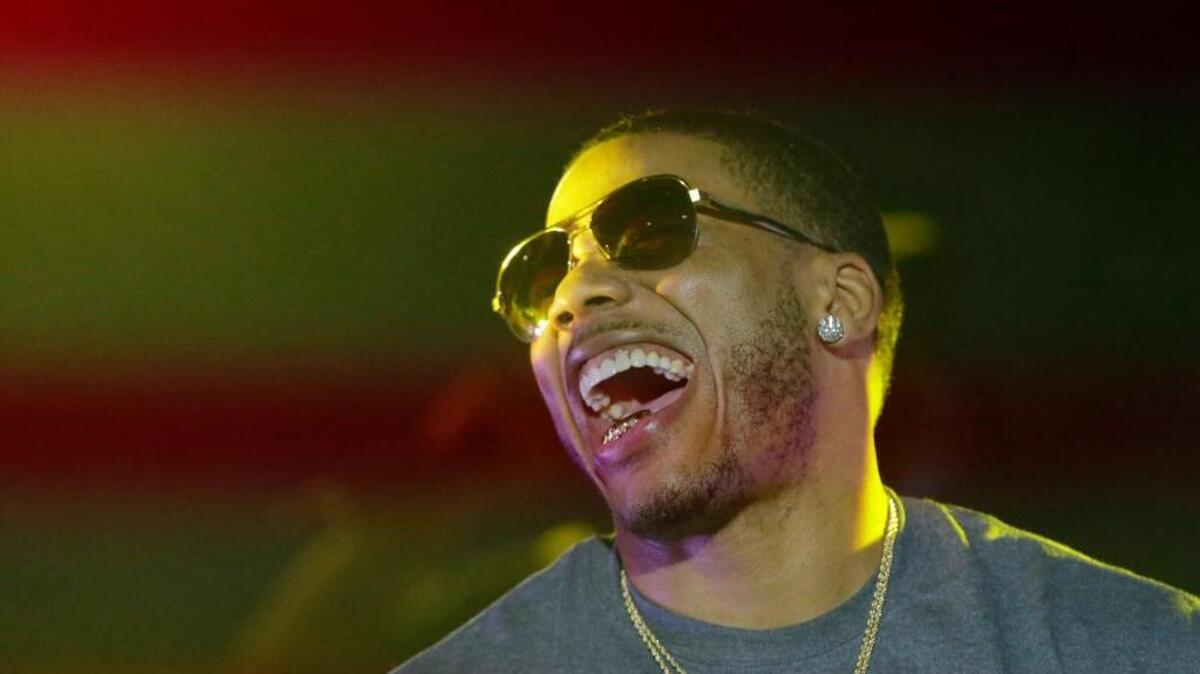 Nelly laughs on stage during a 2015 concert at Auburn University in Auburn, Ala. The hip hop artist headlines a May 19 show at the Lexington Legends’ Whitaker Bank Ballpark.