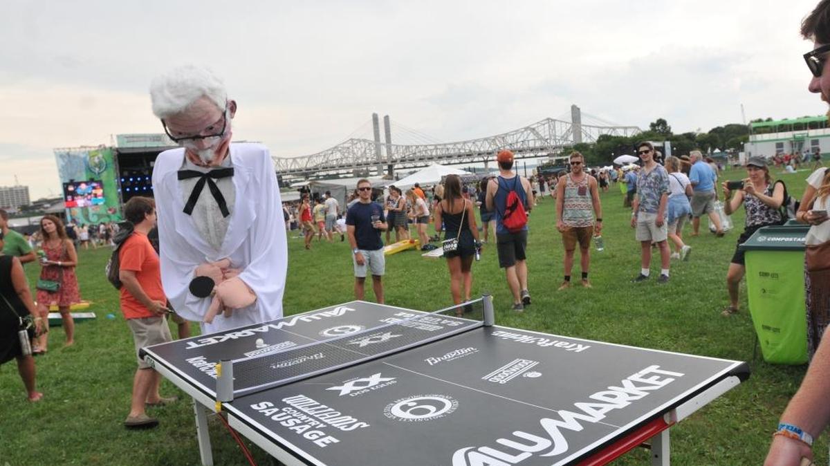 A person in a Col. Sanders costume plays ping pong on the Mast Stage lawn at the Forecastle Festival July 15, 2016 at Waterfront Park in Louisville, Ky.
