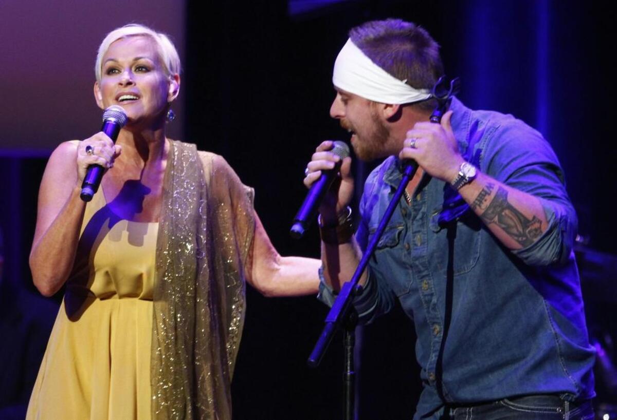 Lorrie Morgan, left, performs with her son Jesse Keith Whitley at the ACM Honors at the Ryman Auditorium on Tuesday, Sept. 10, 2013 in Nashville, Tenn.
