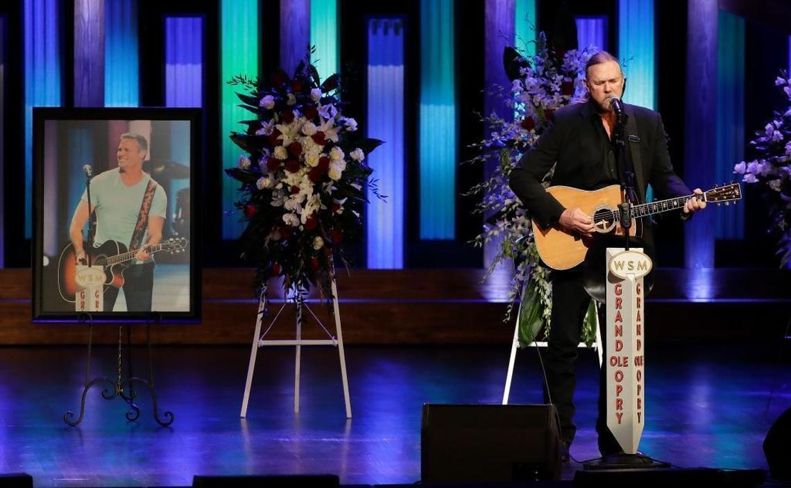 Trace Adkins performs during a memorial service for country music singer Troy Gentry at the Grand Ole Opry House Thursday, Sept. 14, 2017, in Nashville, Tenn. Gentry, who made up the duo Montgomery Gentry with Eddie Montgomery, died Sept. 8 in a helicopter crash.