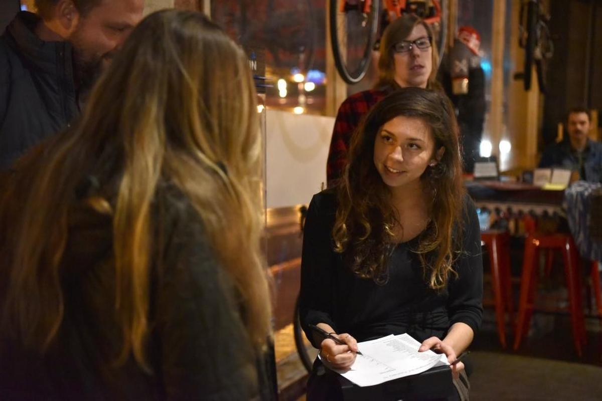 Samantha Howard checks ticket holders into the Feb. 10 SoFar Sounds Lexington concert. She helped found the event after playing SoFar events in other cities with her band, Ryvoli.
