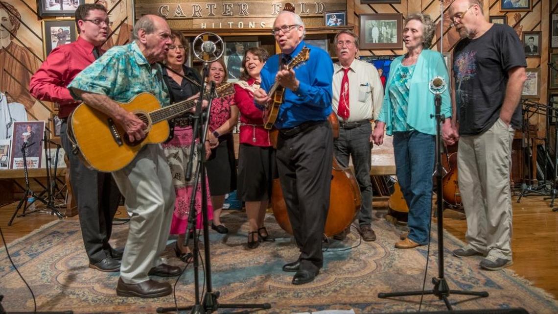 The McLain Family Band was joined onstage by Bill Clifton, left, Carter Family Fold director Rita Forrester, second from right, and actor Eugene Wolfe, far right, during a performance last month in Hiltons, Va.