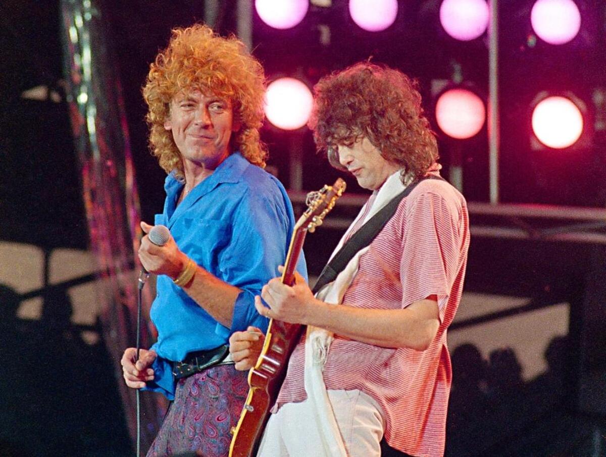 Led Zeppelin bandmates, singer Robert Plant, left, and guitarist Jimmy Page, reunite to perform for the Live Aid famine relief concert at JFK Stadium in Philadelphia in July 1985.