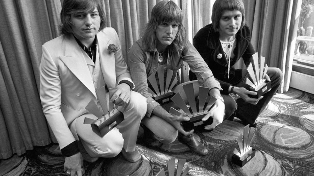 Emerson, Lake and Palmer — (L-R) Greg Lake, Keith Emerson, and Carl Palmer — after an award ceremony in London . Greg Lake, the prog-rock pioneer who co-founded King Crimson and Emerson, Lake and Palmer, has died. He was 69. Lake died Wednesday Dec, 7, 2016 after “a long and stubborn battle with cancer,” according to his manager.