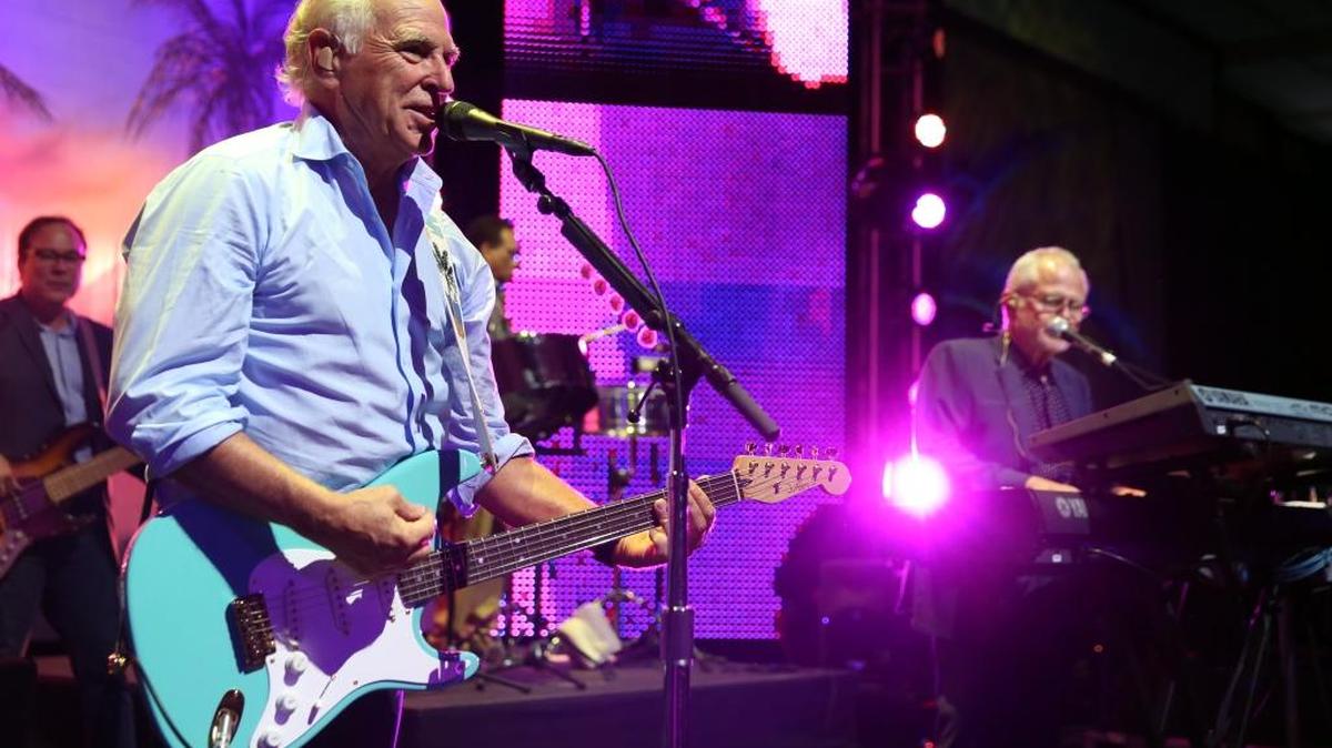 Jimmy Buffett performs at the after party for the premiere of "Jurassic World" in Los Angeles, Tuesday, June 9, 2015. His annual stop at Cincinnati’s Riverbend is June 21.