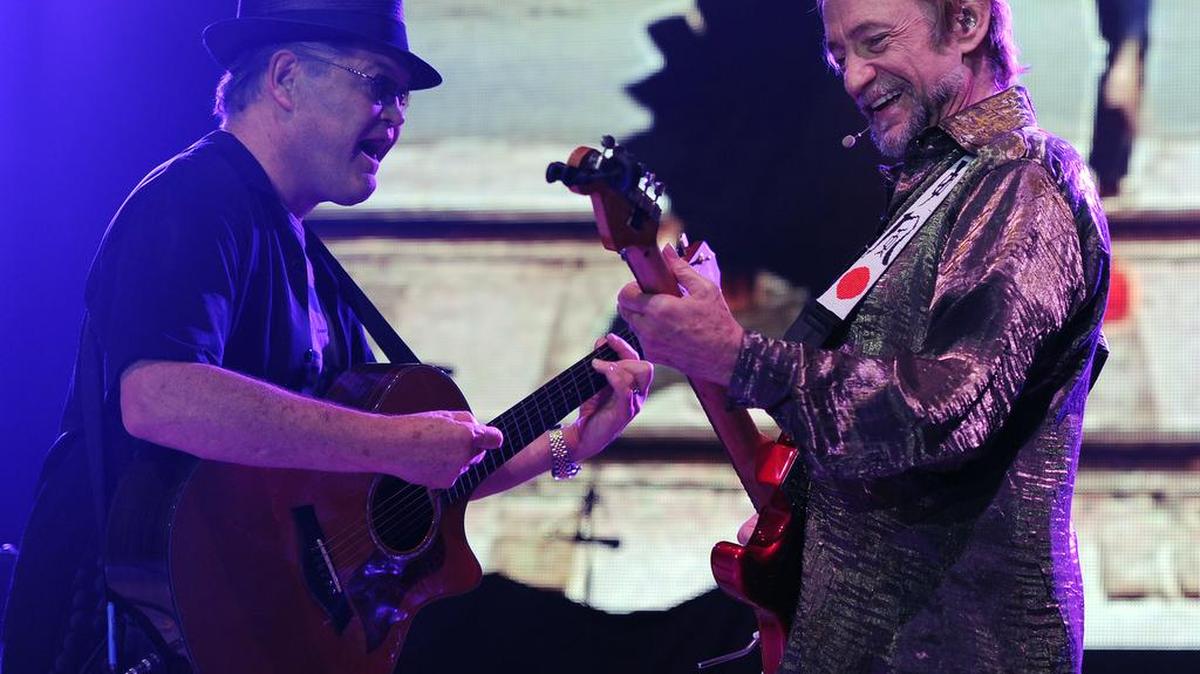 Micky Dolenz and Peter Tork of The Monkees perform at the Mizner Park Amphitheater on Saturday, July 27, 2013 in Boca Raton, Florida. The duo bring their latest tour to the Louisville Palace on June 10, 2016.