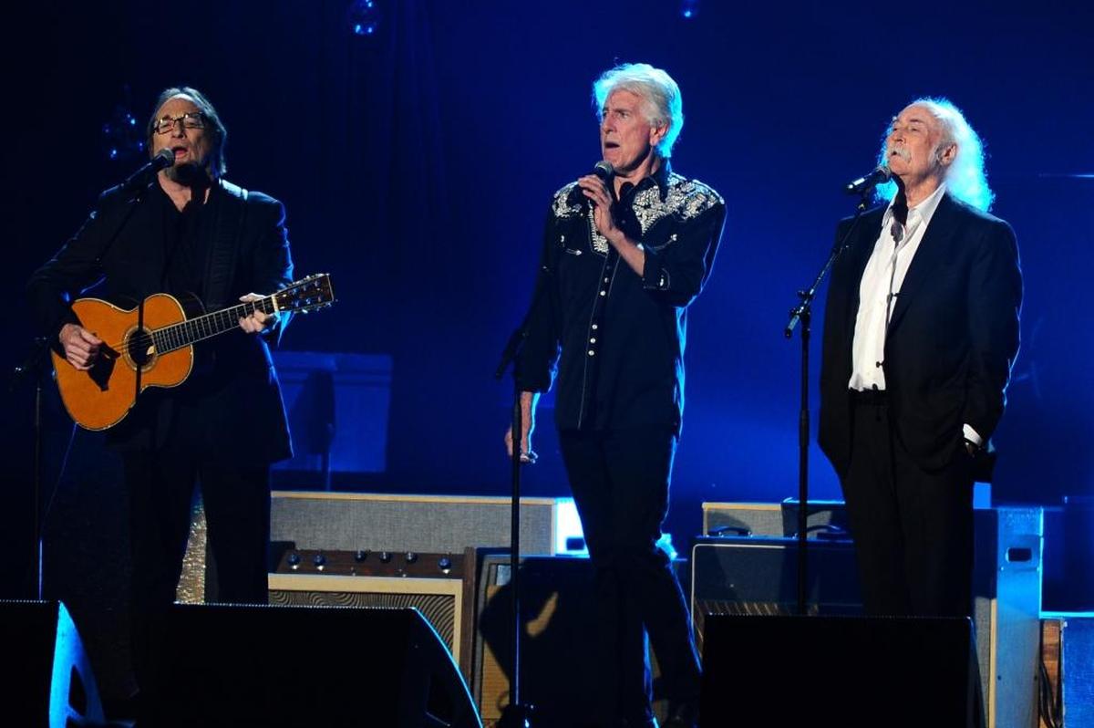 From left, Stephen Stills, Graham Nash and David Crosby perform on stage at the 2015 MusiCares Person of the Year show at the Los Angeles Convention Center on Friday, Feb. 6, 2015, in Los Angeles. After an iconic career, the group has split over some disagreements.
