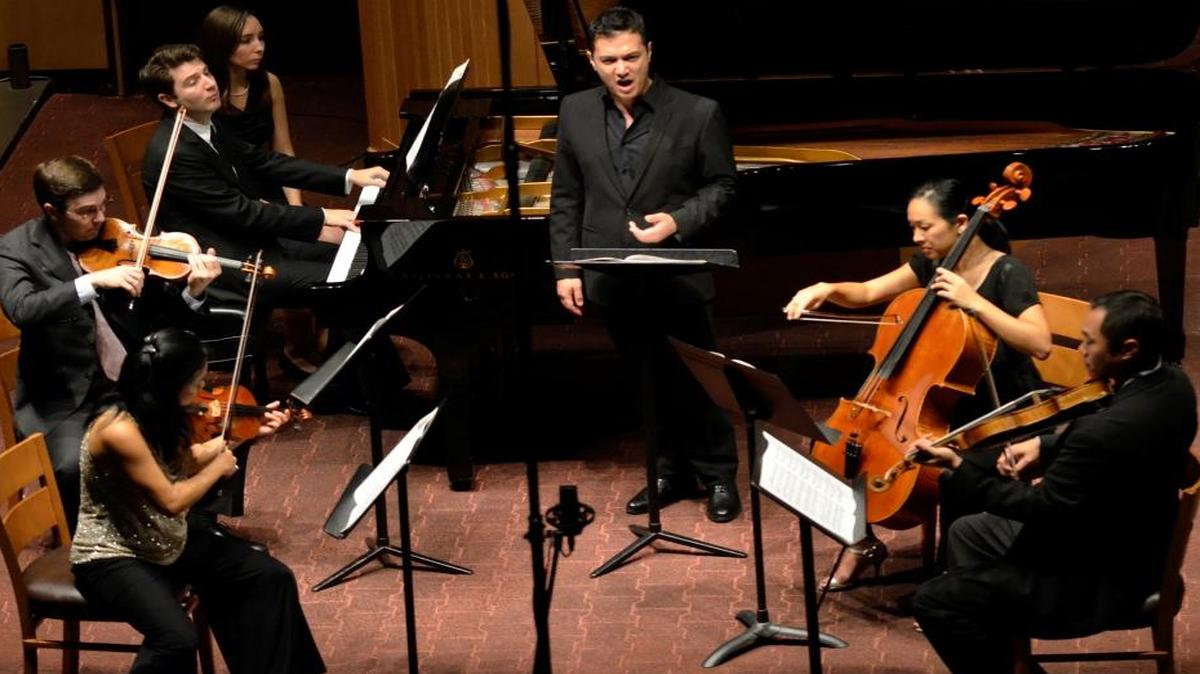 Violinists Akiko Tarumoto and Nathan Cole, pianist Alessio Bax, page turner Melanie Erena, tenor Nicholas Phan, cellist Priscilla Lee, and violist Burchard Tang on stage performing Ralph Vaughn-Williams' "On Wenlock Edge." The first concert of the 2013 Chamber Music Festival of Lexington featured music by Ralph Vaughn-Williams and Ludwig van Beethoven performed by the festival quintet and guest artist Nicholas Phan, tenor. It was Aug. 23, 2013, at the Fasig-Tipton Pavilion, 2400 Newtown Pike in Lexington, Kentucky.