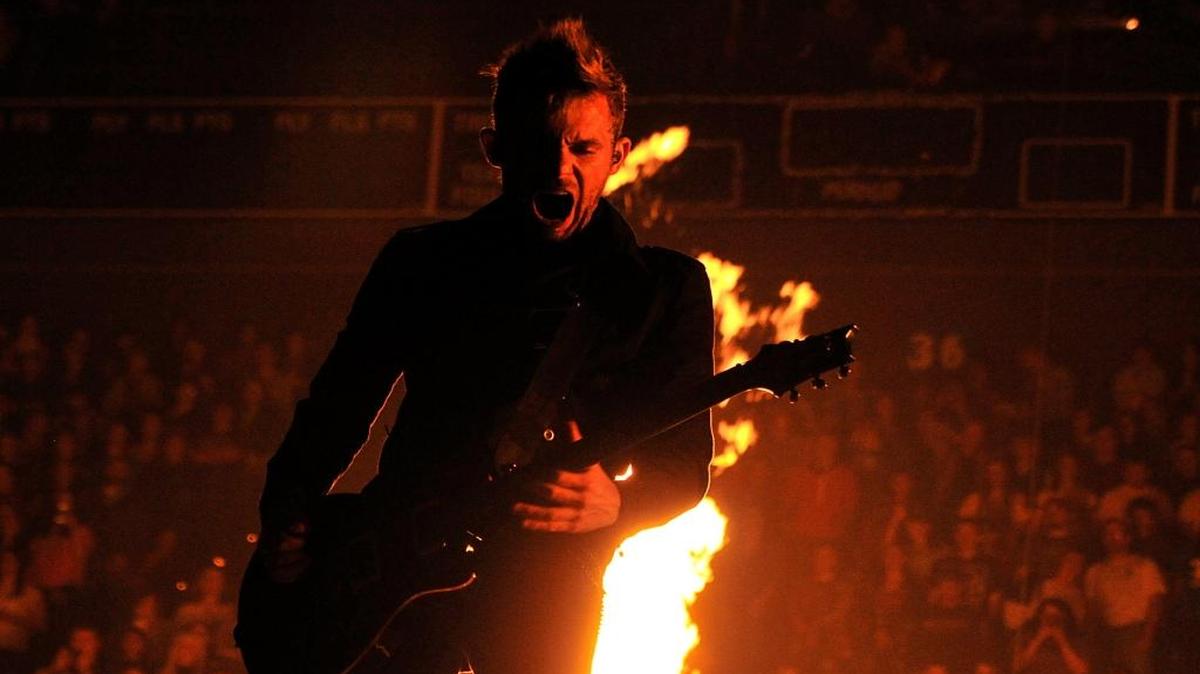 Skillet guitarist Seth Morrison jammed as pyrotechnics went off in Rupp Arena for Winter Jam 2012. The band will return to Rupp Sept. 29 with Britt Nicole, Colton Dixon, Tauren Wells and GAWVI.