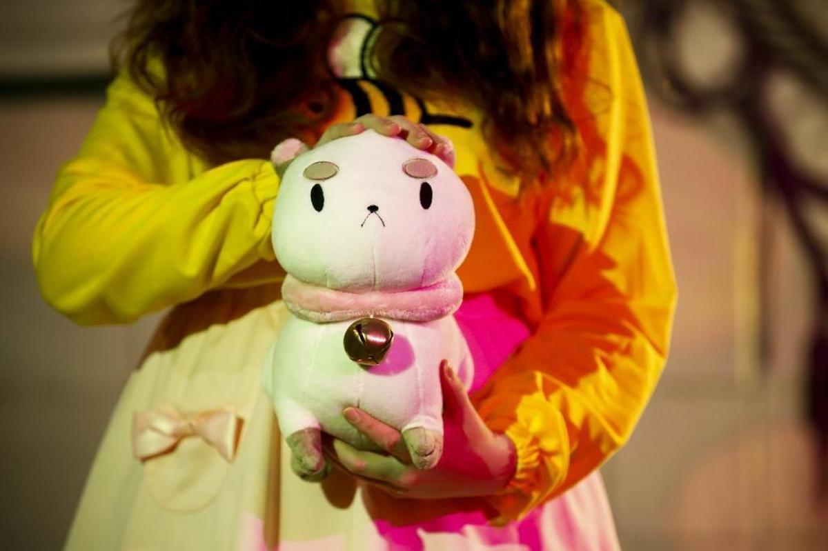 Jillian Krouse, of Lexington dressed as Bee from the animated series “Bee and PuppyCat” held a stuffed animal of the character PuppyCat.
