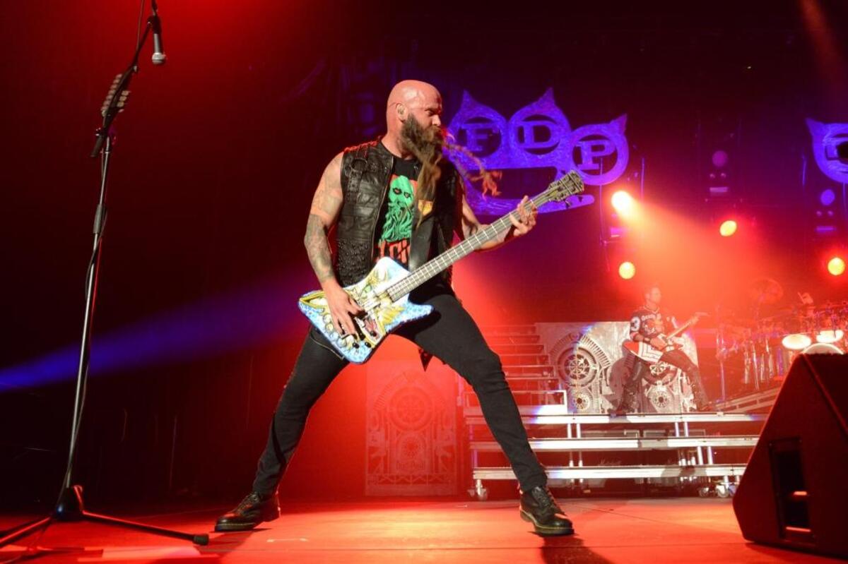 Chris Kael of Five Finger Death Punch performs on stage at Rupp Arena in Lexington, Ky., his home town, on Sept. 4, 2015.
