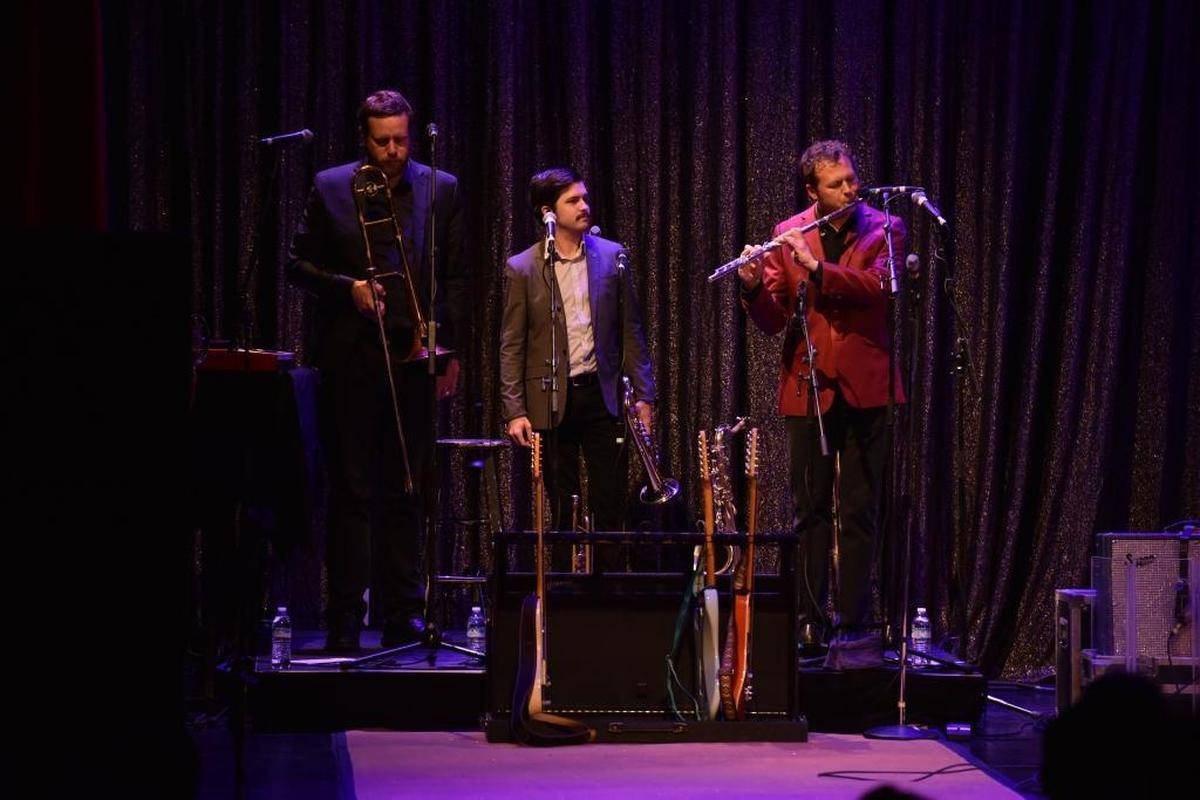Chad Fisher and Allen Branstetter of St. Paul & The Broken Bones watch as Jason Mingledorff plays a flute solo at the Lexington Opera House on Nov. 15, 2017.