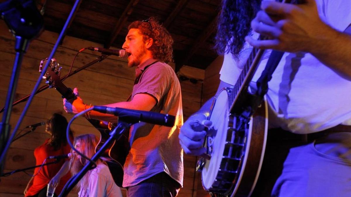 Grayson Jenkins, accompanied by Kris Bentley, second from left, of Sundy Best, performed June 25 at The Burl. Sundy Best’s success inspired Jenkins to pursue a music career full time.