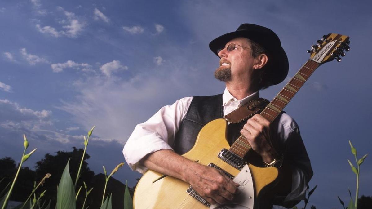 Roger McGuinn with his iconic 12-string Rickenbacker guitar.