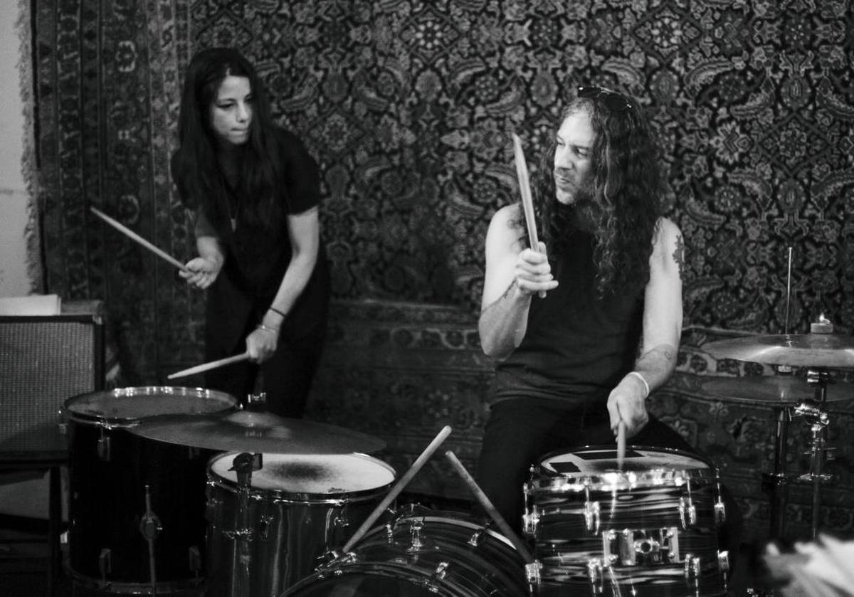 Drummers Emily Hagihara ,left, and Robby Cosenza team up on the drums during The Wags, rehearsal on Wednesday June 18, 2015 in Lexington.
