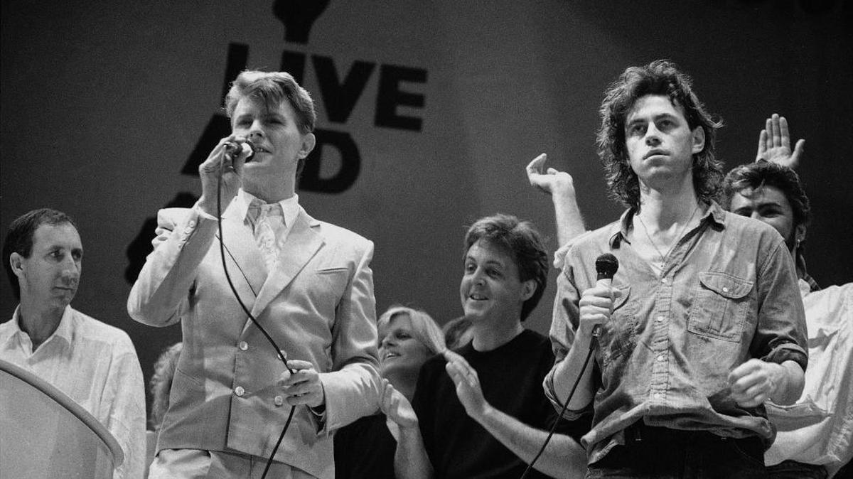 David Bowie on stage with Bob Geldof during the London finale of the Live Aid concerts on July 13, 1985.