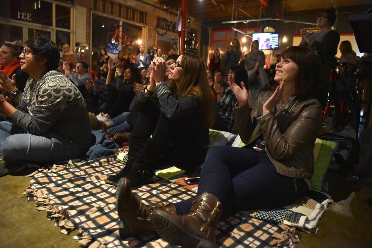 Jenny Drake and Vanessa Davis clap for Coastal Club at the February SoFar Lexington concert at Bicycle Face.
