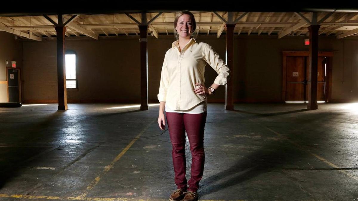 Kaelyn Query, director of programming for Manchester Music Hall, in the former Buster's space in the Discretely District on Manchester Street in Lexington, Ky, on Nov. 23, 2015.