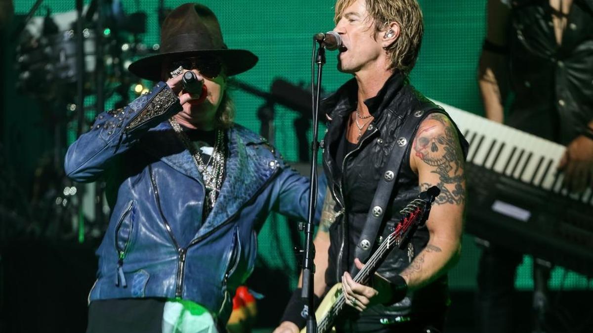 Axl Rose, left, and Duff McKagan of Guns N' Roses perform at the 6th Annual Revolver Golden Gods Award Show at Club Nokia on April 23, 2014 in Los Angeles, California. The reunited band’s summer tour includes a stop at Cincinnati’s Paul Brown Stadium.