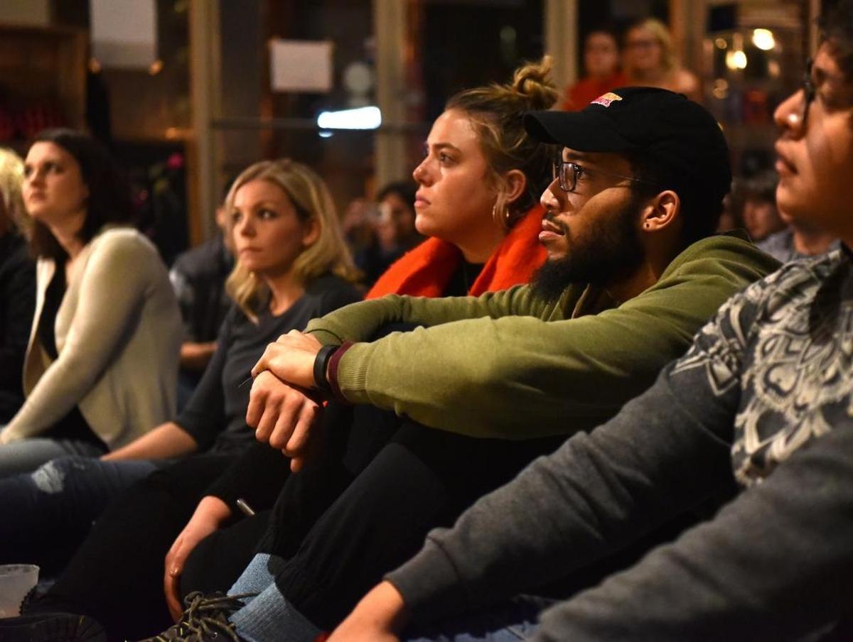 Rachel Williamson and Qaaim Stainback of Lexington watch Coastal Club perform at Bicycle Face for SoFar Lexington.
