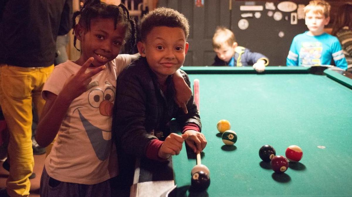 Gabrielle and Jeremiah play pool at Al’s Bar Children’s Series in Lexington, Kentucky on Friday, December 9, 2017. Music for kids made by kids beginning at 5:30 p.m. on many Fridays. The next one is Jan. 19.