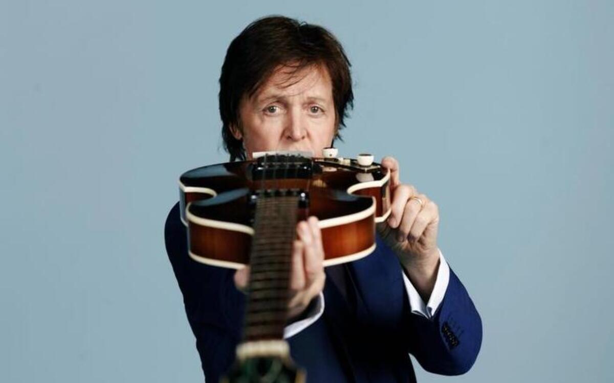 Sir Paul McCartney, with his iconic Hofner violin bass.