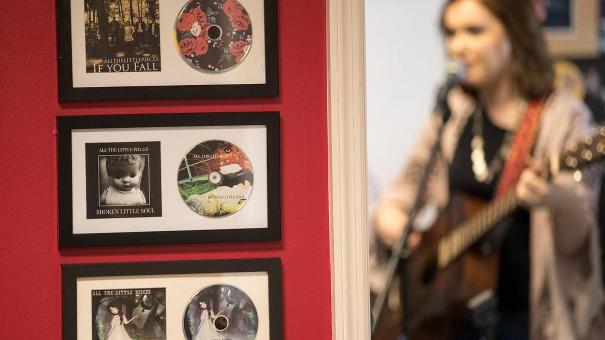 Rhyan Sinclair sang as her band, All the Little Pieces, rehearsed at her home, where album covers, including “The Legend of Lavinia Fisher,” hung on a wall. “The Legend of Lavinia Fisher” is one of four nominees for album of the year at the Lexington Music Awards.