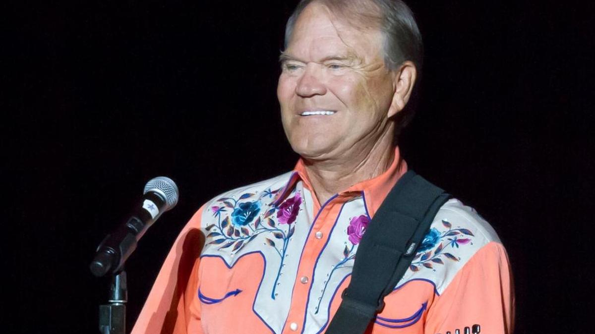 Glen Campbell performing during his Goodbye Tour in Little Rock, Ark. Campbell, the grinning, high-pitched entertainer who had such hits as "Rhinestone Cowboy" and spanned country, pop, television and movies, died Tuesday, Aug. 8, 2017. He was 81. Campbell announced in June 2011 that he had been diagnosed with Alzheimer's disease.