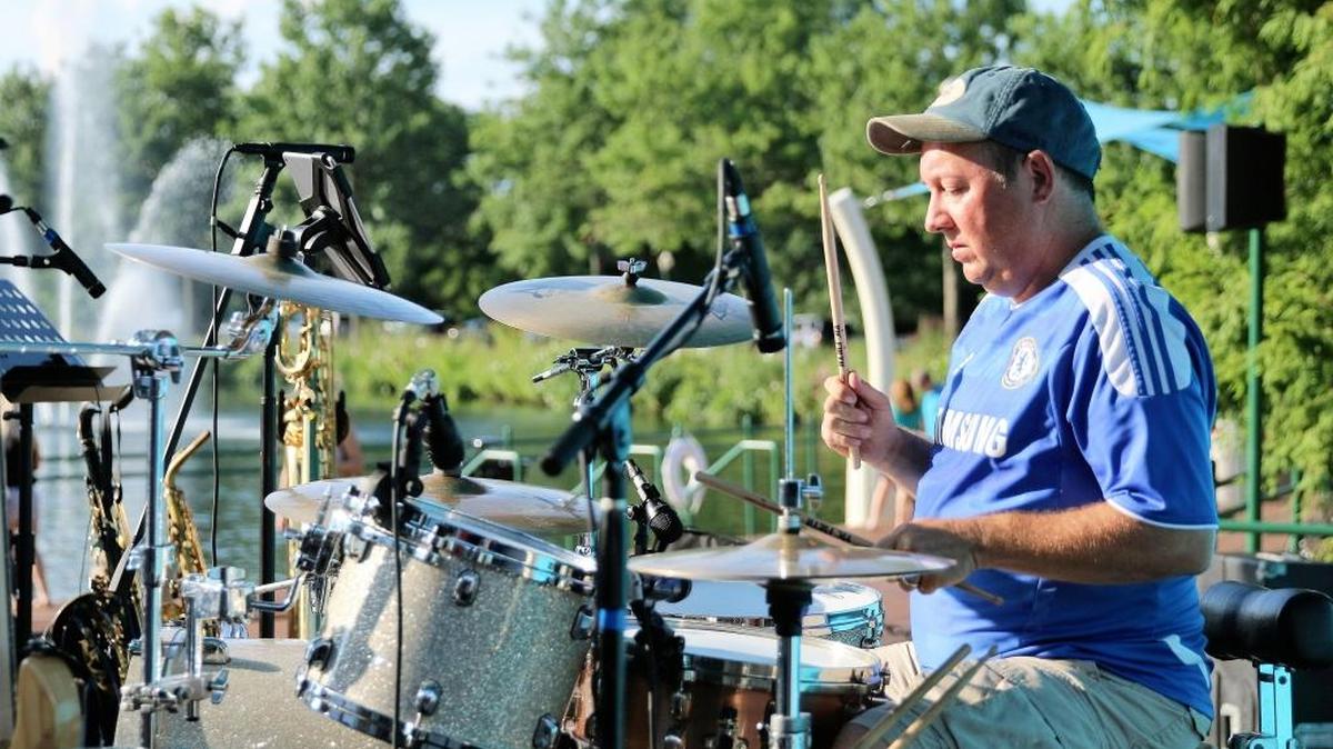 Tim Patterson, aka “Harry Twiggenbury” performs with The Twiggenburys at Lakeside Live, a concert series held on Fridays and Saturdays at The Mall at Lexington Green on July 29, 2016.