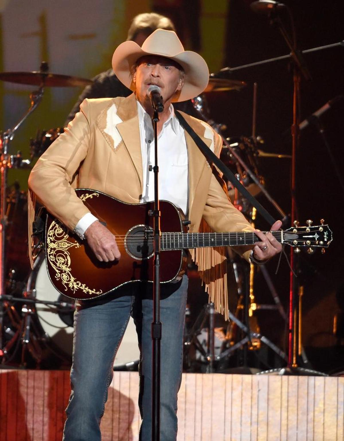 Alan Jackson performs “Chasin’ That Neon Rainbow” at the 51st annual CMA Awards at the Bridgestone Arena on Nov. 8, 2017, in Nashville, Tenn.