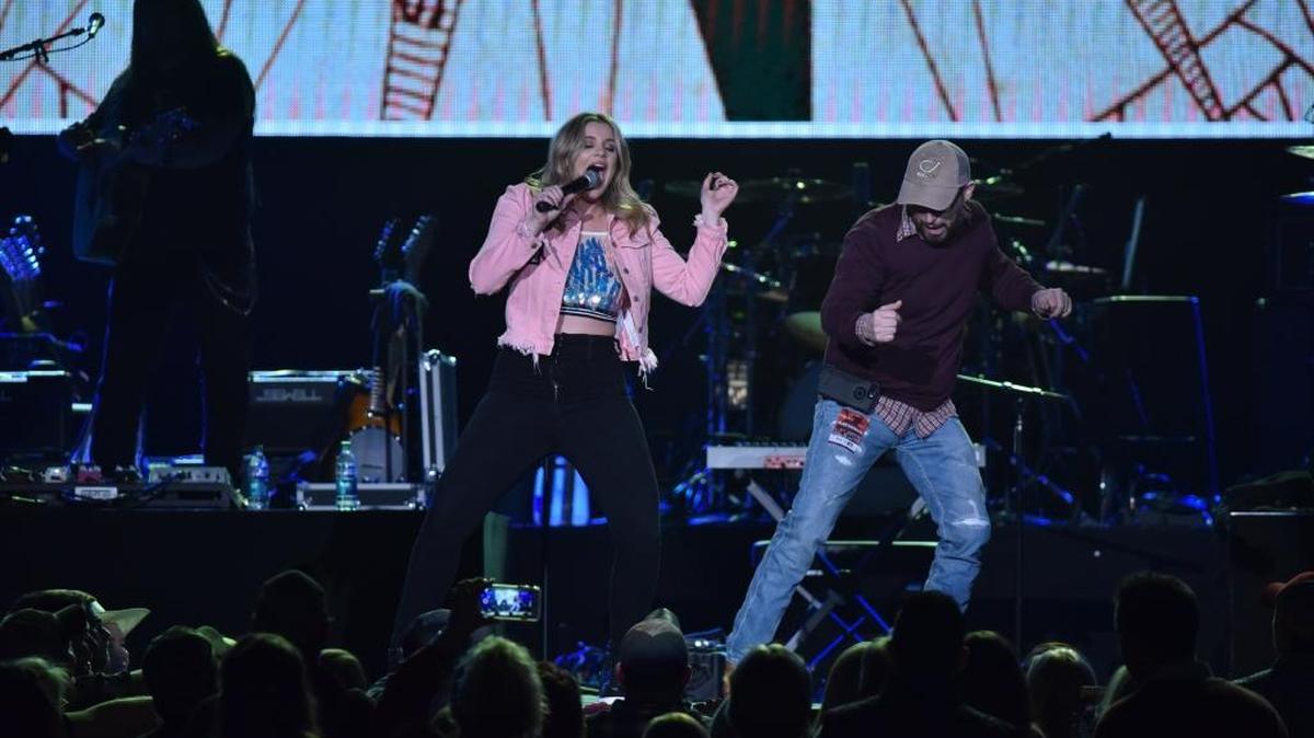 Lauren Alaina dances with her “Next Boyfriend” Joe, a fan pulled from the crowd at Rupp Arena in 2018.