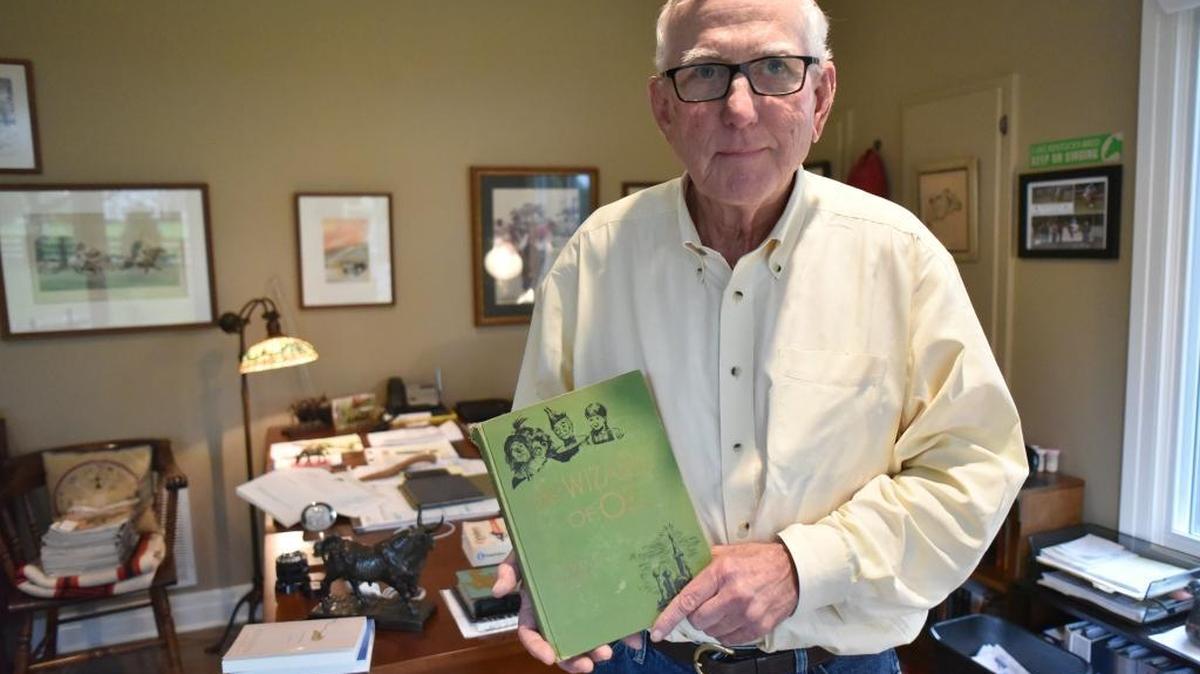Lexington bloodstock agent John Donaldson with one of his copies of “The Wizard of Oz,” by his great grandfather L. Frank Baum, who wrote other successful books at the turn of the 20th century.