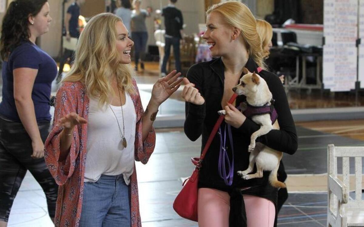 Emma Degerstedt, who plays Elle Woods, holds Chico, the original Bruiser on Broadway, as she gets some tips from co-director Laura Bell Bundy, who created the role of Elle Woods in the original Broadway production, during a rehearsal of Lexington Theatre Company's production of “Legally Blonde — The Musical” in Lexington.