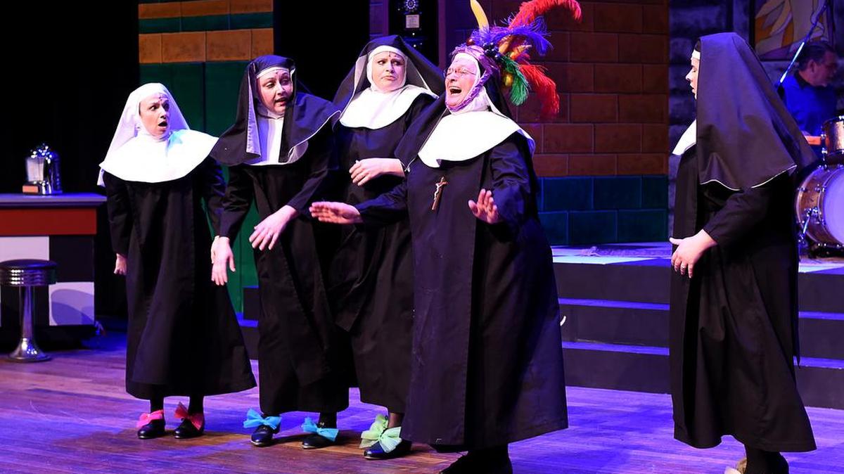 From left, Kelli Jo Crawford as Sister Mary Leo, Melissa Rae Wilkeson as Sister Robert Anne, Jessica Pearl French as Sister Mary Hubert and Madeline Williamson as Sister Mary Amnesia, right, reacted as Reverend Mother Regina (Patricia O’Neill) accidentally got high after sampling an item confiscated from a student in the Woodford Theatre production of “Nunsense.”