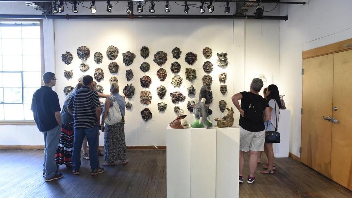 Family and visitors at the Kentucky Governor’s School for the Arts looked at masks made by visual arts students during the final performance day at the Governor’s School for the Arts at Centre College in Danville.
