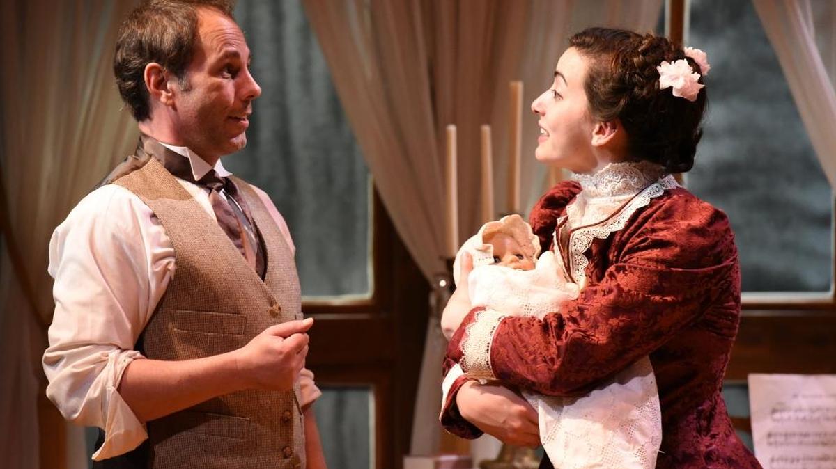 Dr. Givings (Tim Hull) and Catherine (Taylor Schulz) talk about care for their daughter in the AthensWest Theatre Company presentation of Sarah Ruhl’s “In the Next Room, or the Vibrator Play” at the Downtown Arts Center in Lexington.