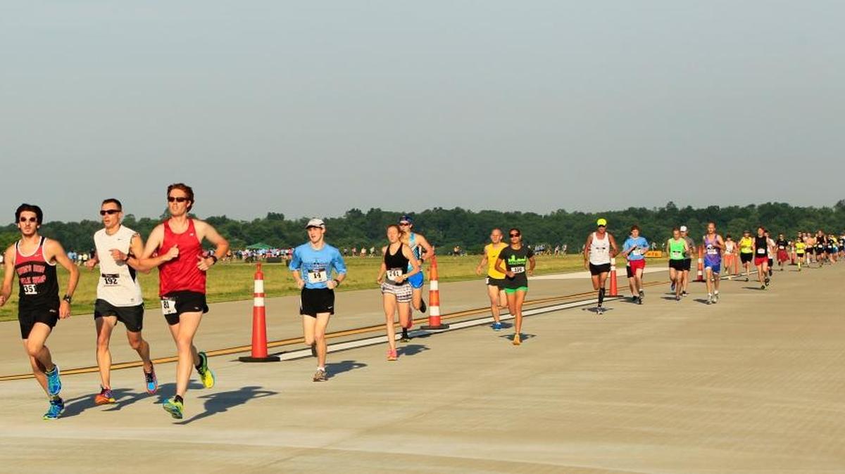 Race leaders made their first lap of the runway during the 5K on the Runway at Blue Grass Airport in 2013.