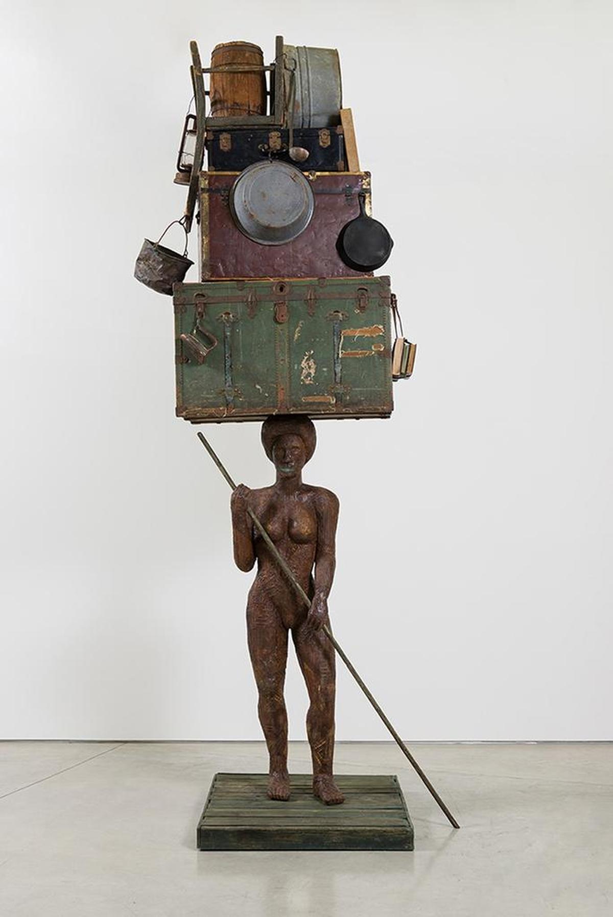 Alison Saar’s “Breach” looks at the 1927 Great Mississippi River Flood. This piece is made from ceiling tin, found trunks, washtubs and miscellaneous objects.