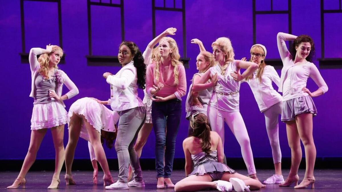 Emma Degerstedt as Elle Woods, center, and dancers during a rehearsal of the Lexington Theatre Company’s production of “Legally Blonde — The Musical.”