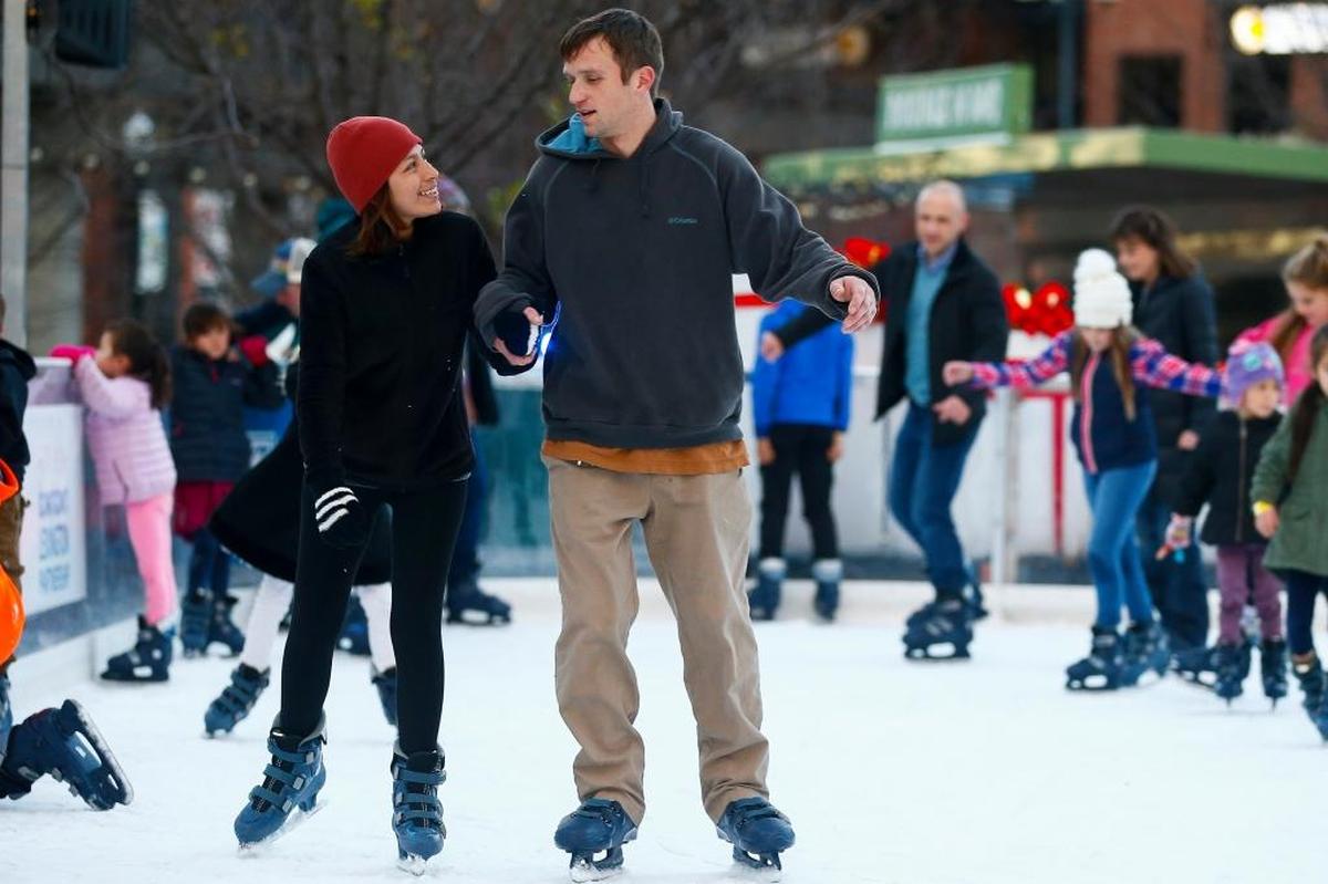 Johana Teany and Bill Teany, both of Lexington, Ky., skate on the Unified Trust Company Ice Rink before the annual tree lighting ceremony during Luminate Lexington at Triangle Park in downtown Lexington, Ky., Friday, Nov. 24, 2017.