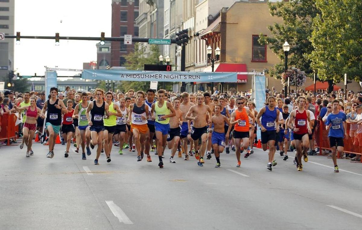 Runners took off from the starting line for A Midsummer Night’s Run in 2015. This year’s event is Saturday in downtown Lexington.