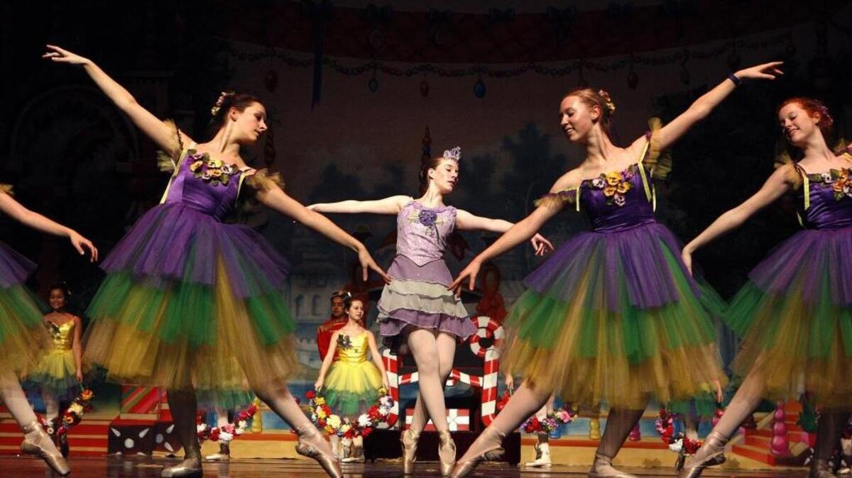 Amelia Caldwell, left, Emma Guenthner and Kate Cox rehearsed a scene from Bluegrass Youth Ballet’s production of The Nutcracker in One Act at Singletary Center for the Arts in Lexington.