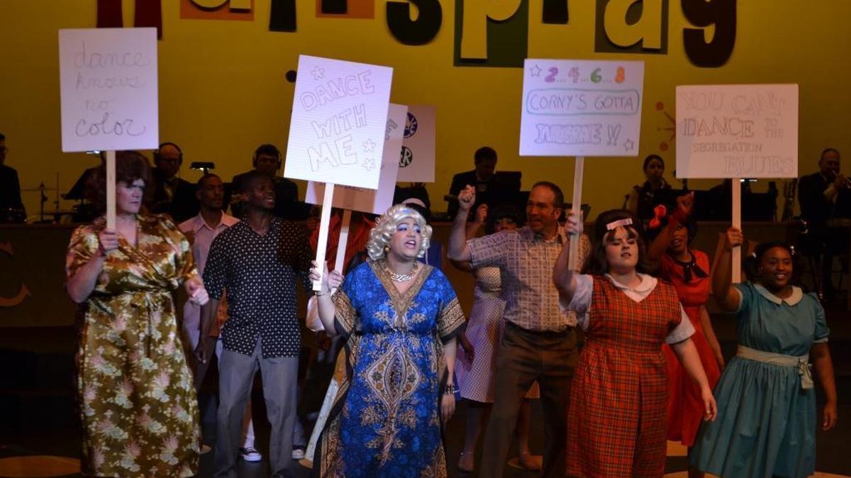 From left, Edna (Robert Parks Johnson), Maybelle (Jessica Slaton Greene), Tracy (Madeline Williamson) and Little Inez (Kennedy Johnson) lead a protest to integrate “The Corny Collins Show” in a scene from “Hairspray.”