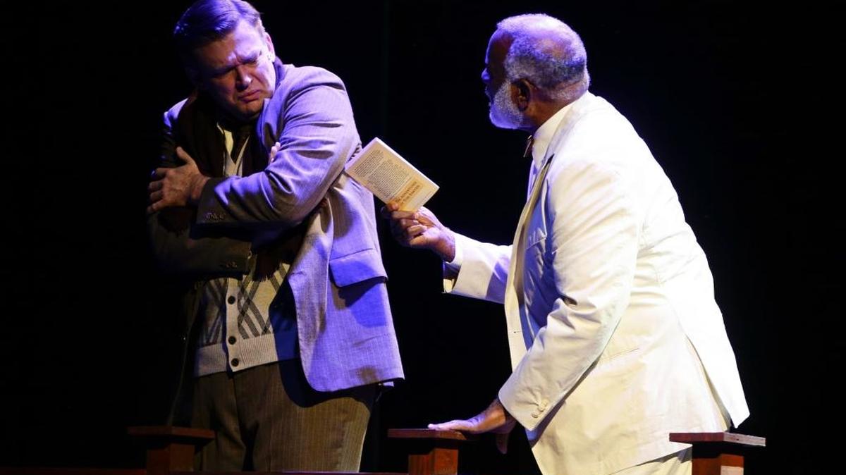 Jason Meenach, left, as George Bailey, on the bridge contemplating suicide , talked down by his guardian angel Clarence Odbody, played by Virgil Covington, Jr., during rehearsal for Woodford Theatre’s production of “It’s a Wonderful Life,” on Tuesday November 29, 2016 in Versailles, Ky.
