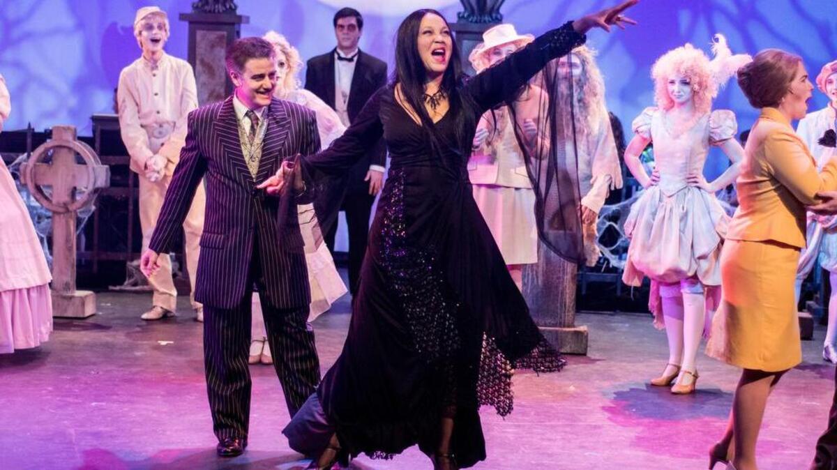 Carmen Geraci plays Gomez Addams and Alicia McCorvey is Morticia Addams in The Woodford Theatre’s production of “The Addams Family.” The creepy comedy runs through Oct. 23.